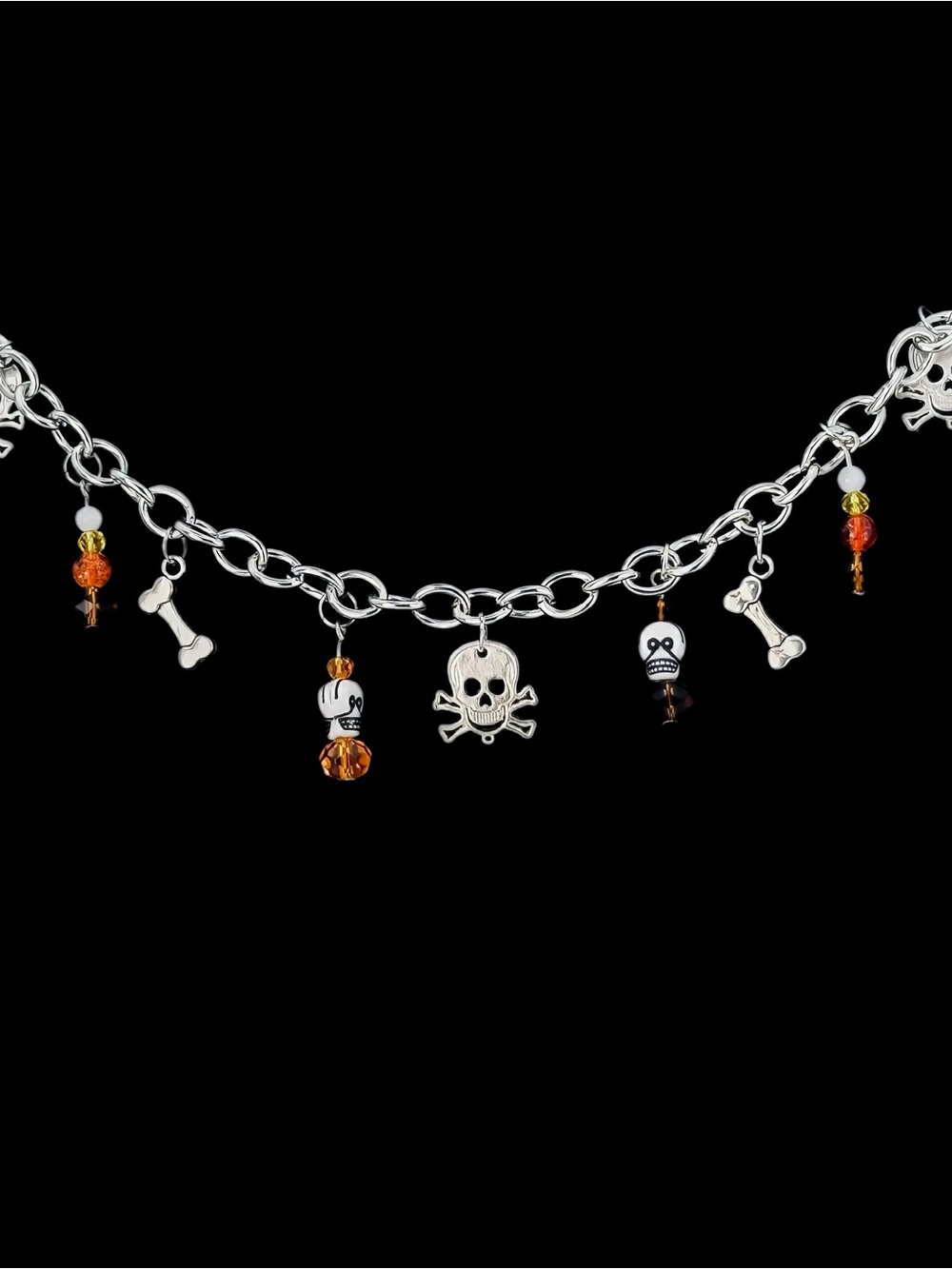 Silver Skull Charm Bracelet with Orange Crystal Accents